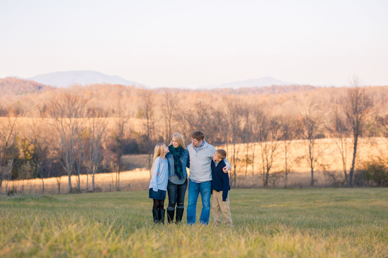 fall family photos in a field with mountains at sweet briar college