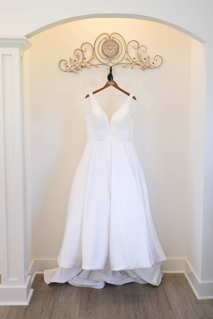 wedding dress hanging in cedar oaks farms bridal suite